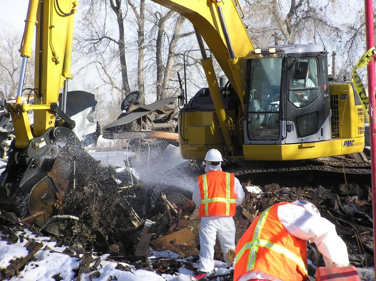 Dust suppression during contaminated demolition and removal