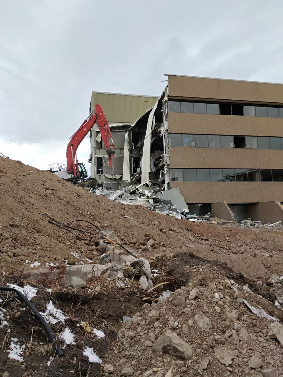 Structural demolition with dust control
