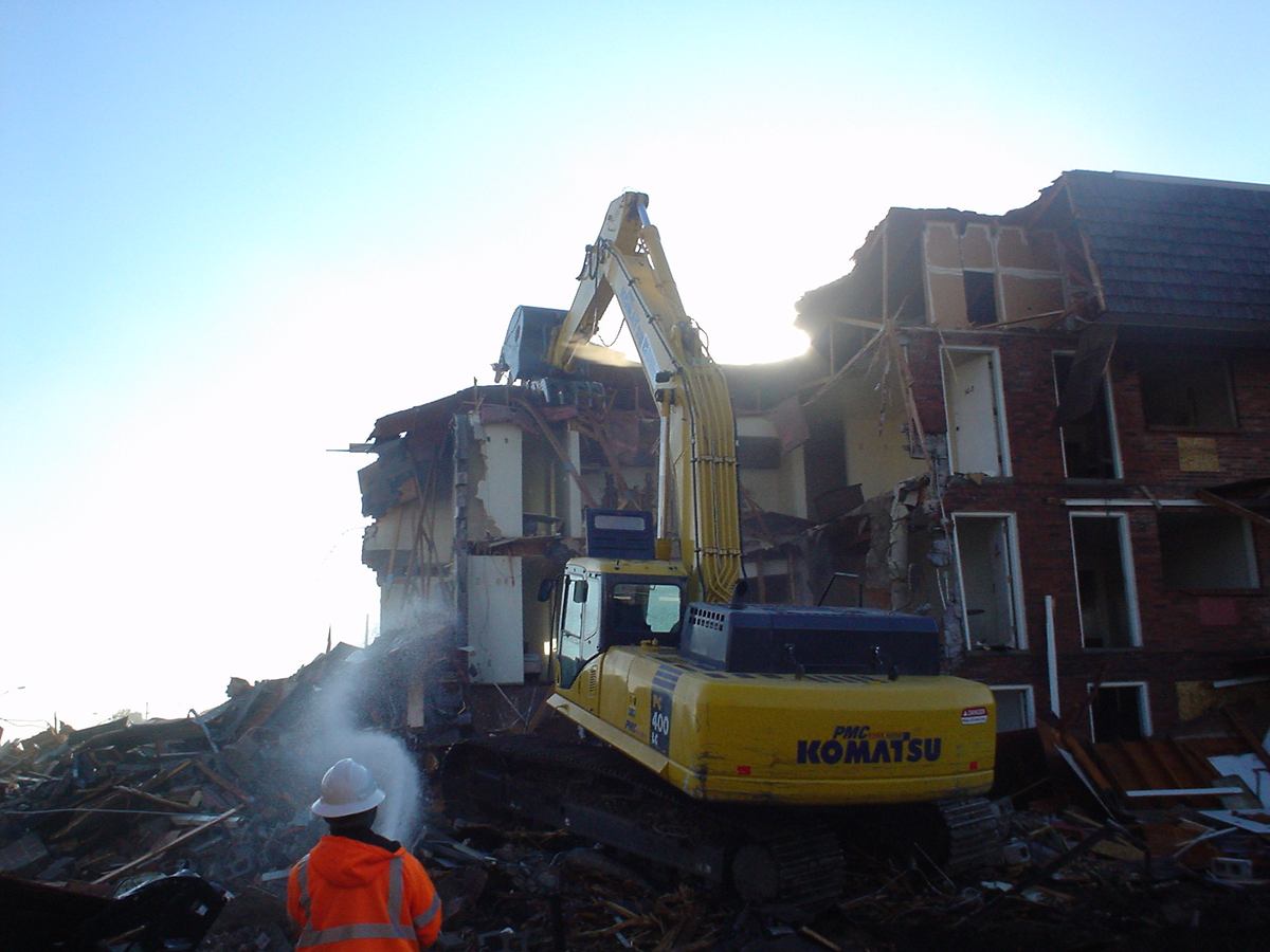 High-reach demolition of upper floors with dust control