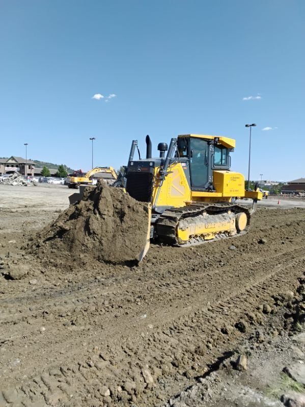 Loader and blade grading a long drive lane