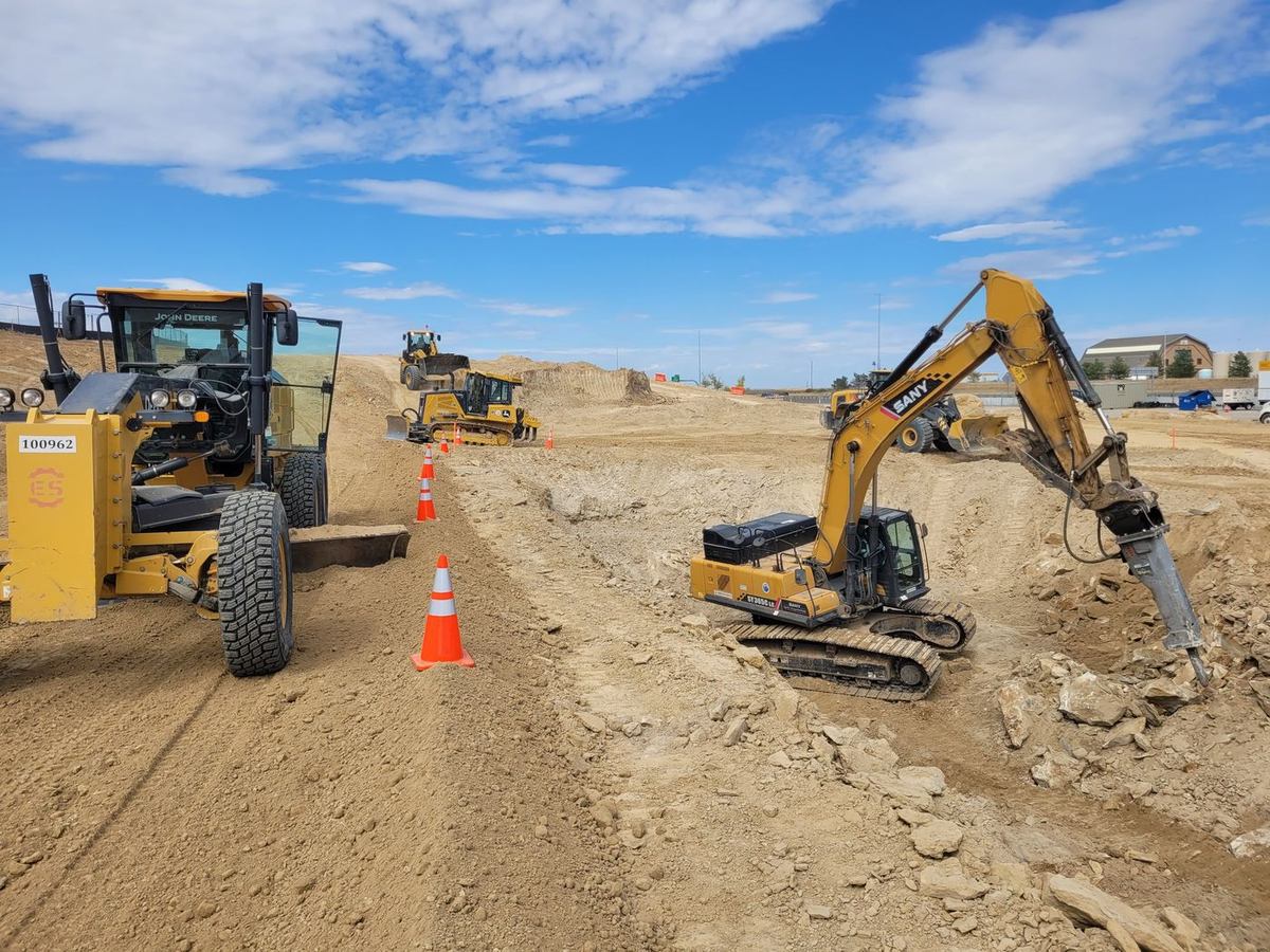 Two heavy excavators working a rock excavation