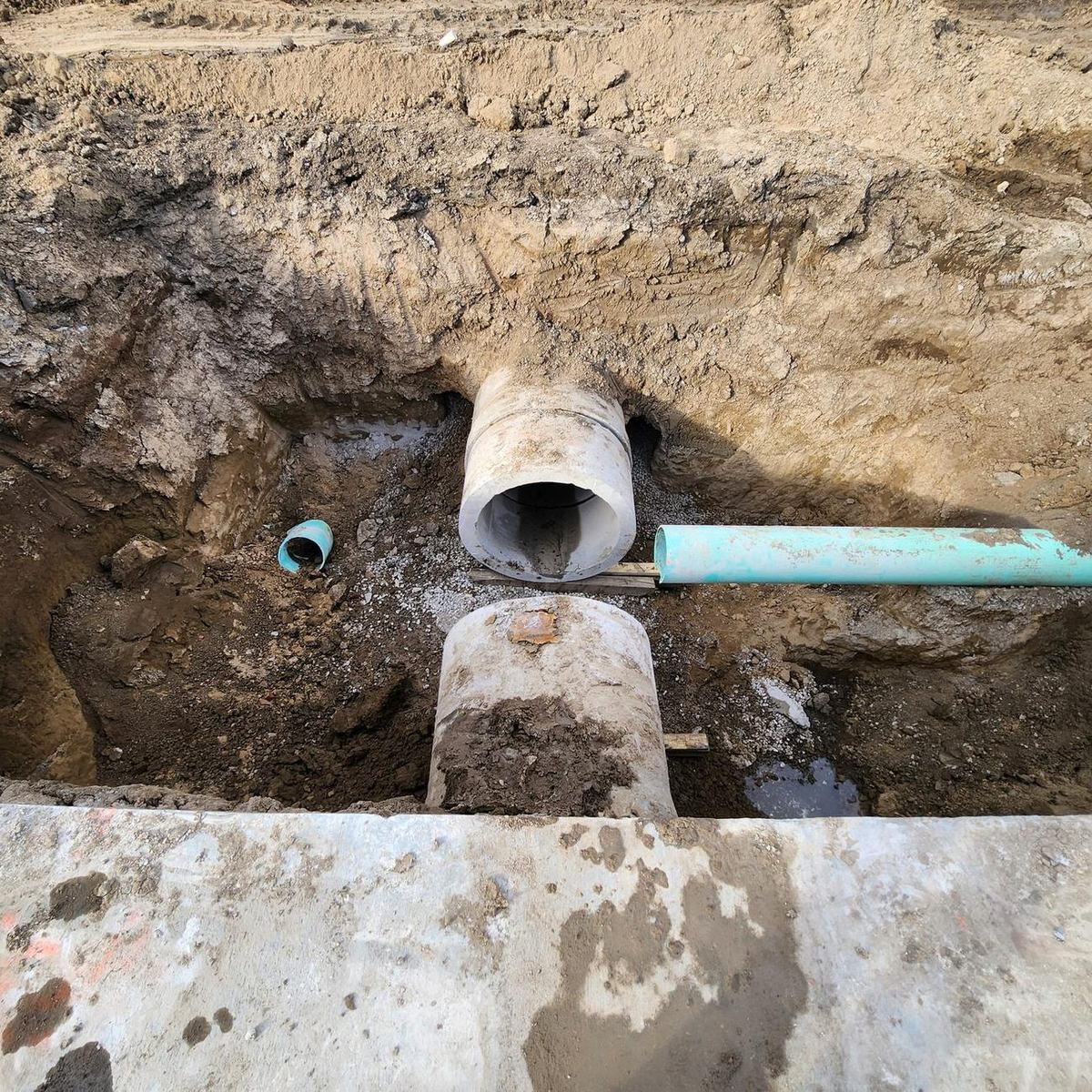 RCP storm pipe connected into a cast-in-place concrete structure