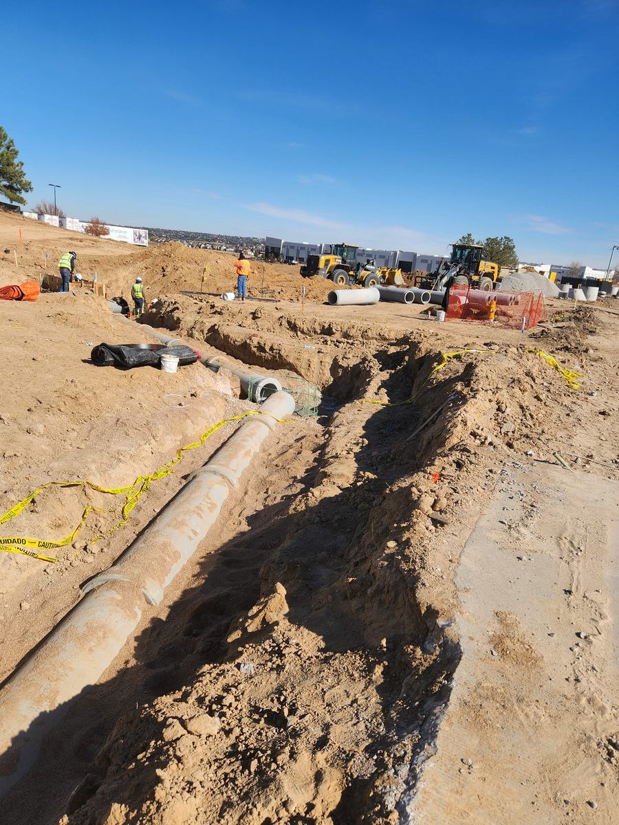 Run of RCP storm main installed in an open trench on a commercial site