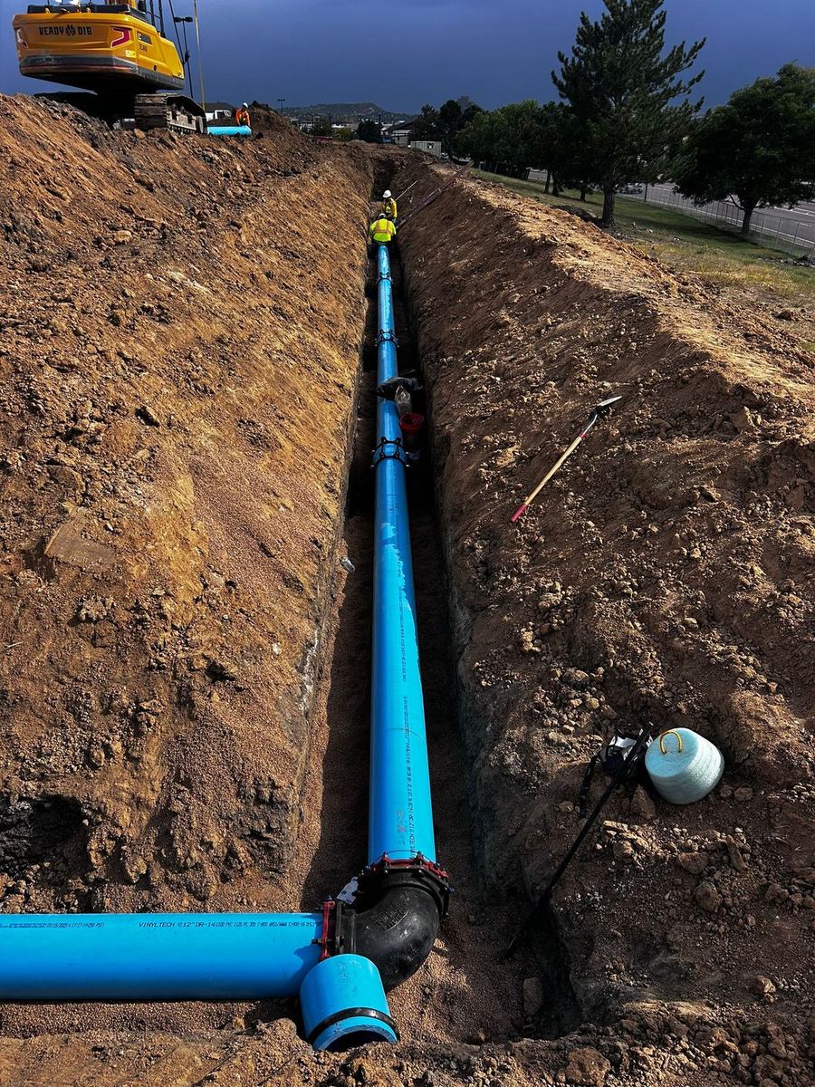 12-inch C-900 water main installed in a deep trench with fittings